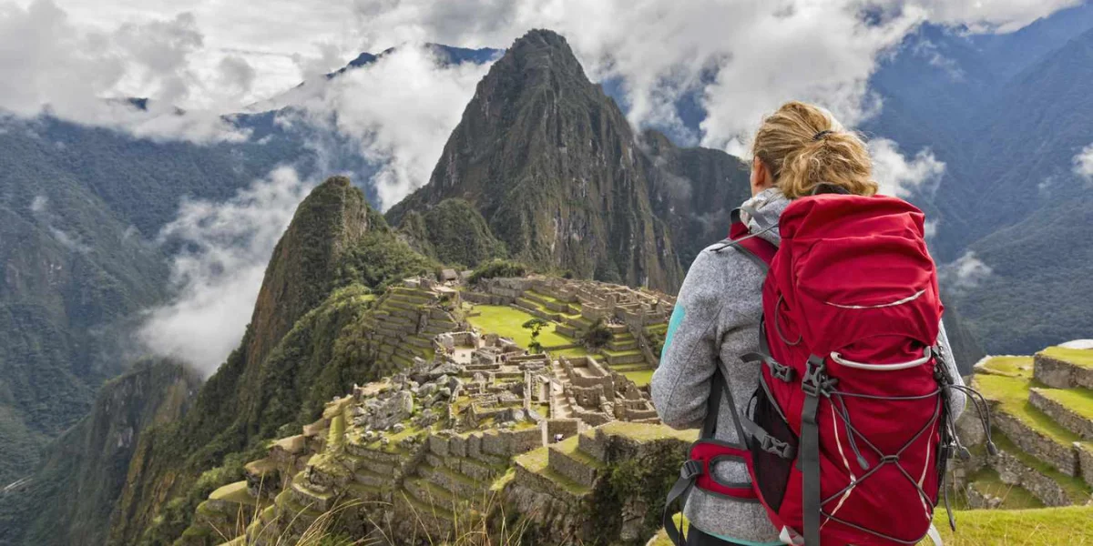 Backpackers at Machu Picchu, Peru – affordable travel and iconic view - Peru Bucket List