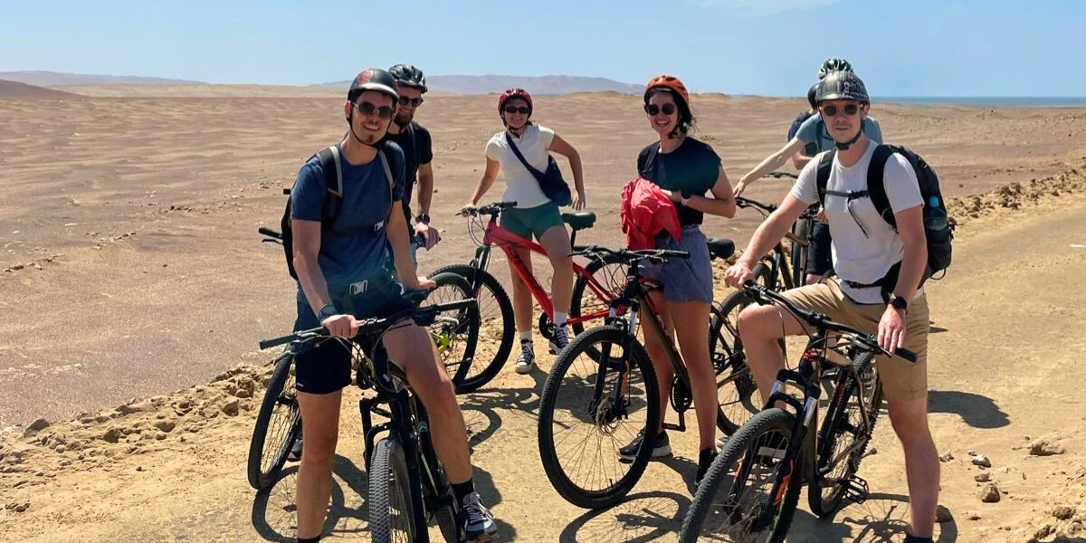 Biking Tour through Paracas National Reserve desert landscape with ocean views - Peru Bucket List