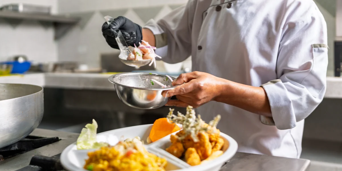 Chef preparing ceviche tableside with fresh fish, limes, and ají peppers - Peru Bucket List