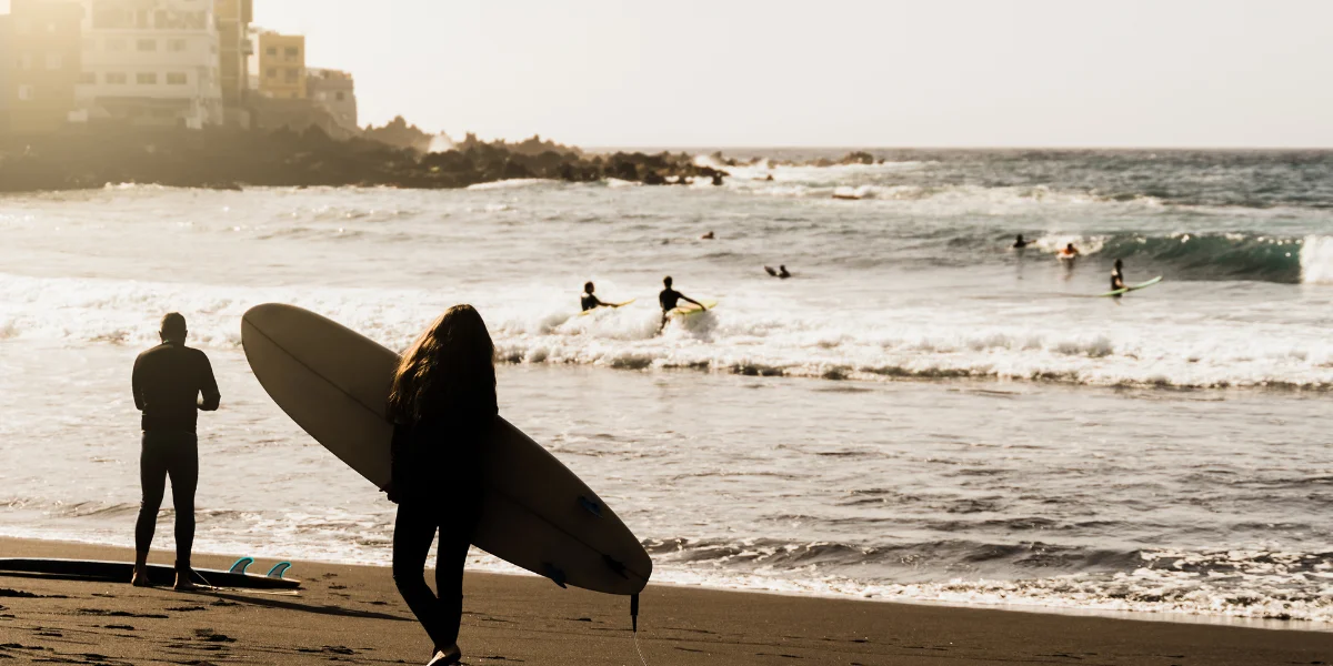 Surfers enjoying the waves at Punta Hermosa, a beautiful coastal neighborhood in Lima, Peru