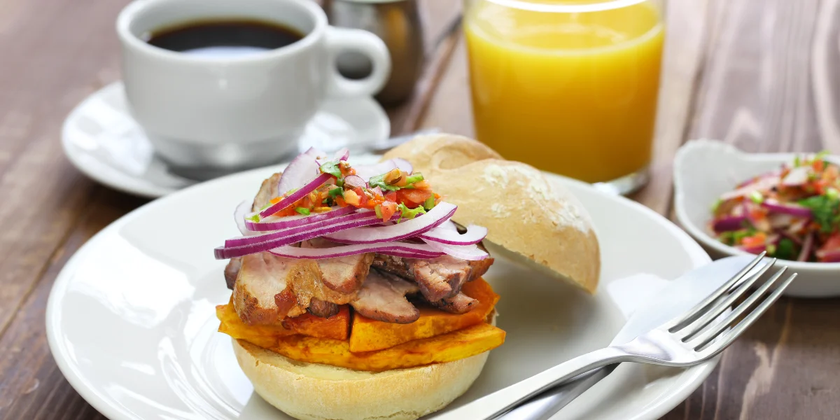 traditional breakfast with Pan con Chicharrón in Lima - Peru Bucket List