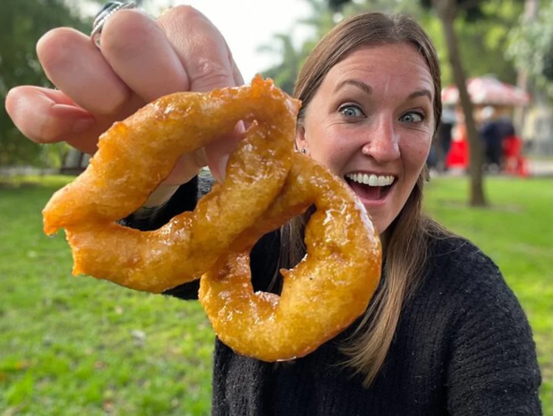 Freshly prepared picarones served during a Lima Street Food Tour, showcasing one of Peru’s most beloved traditional desserts.