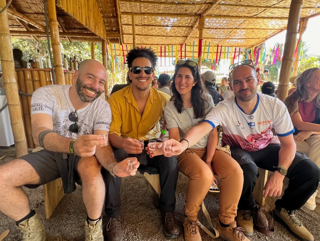 Travelers enjoying a traditional Pisco tasting at a vineyard in Ica, Peru