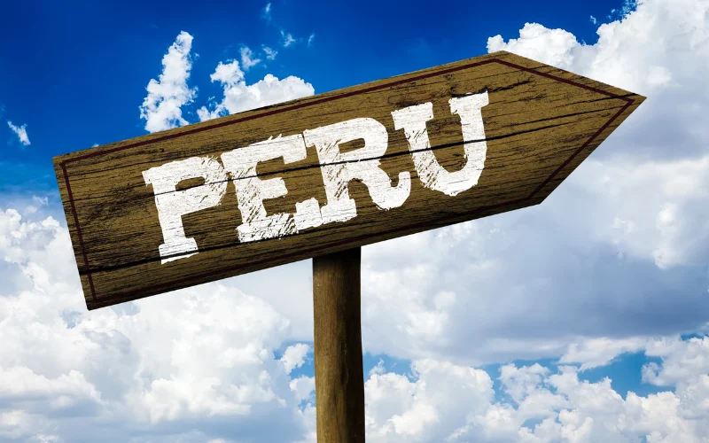 Peru travel destinations sign pointing travelers toward the best places to visit in Peru