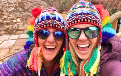 Travelers with local guides in traditional Peruvian clothing
