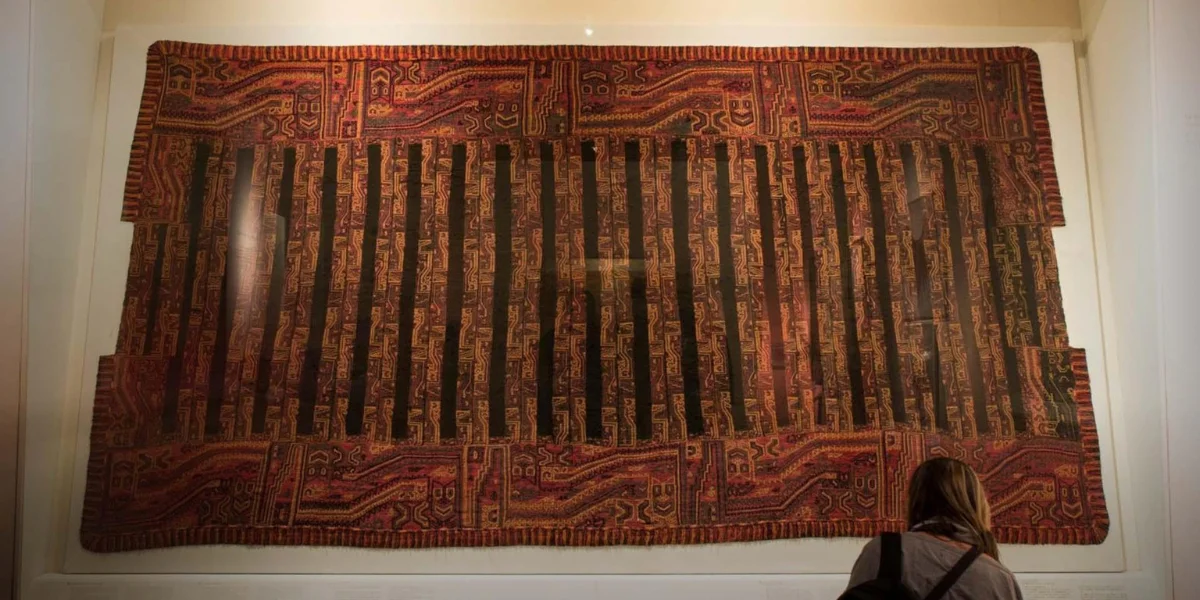 Ancient Paracas textile with intricate geometric designs from the Paracas culture in Peru
