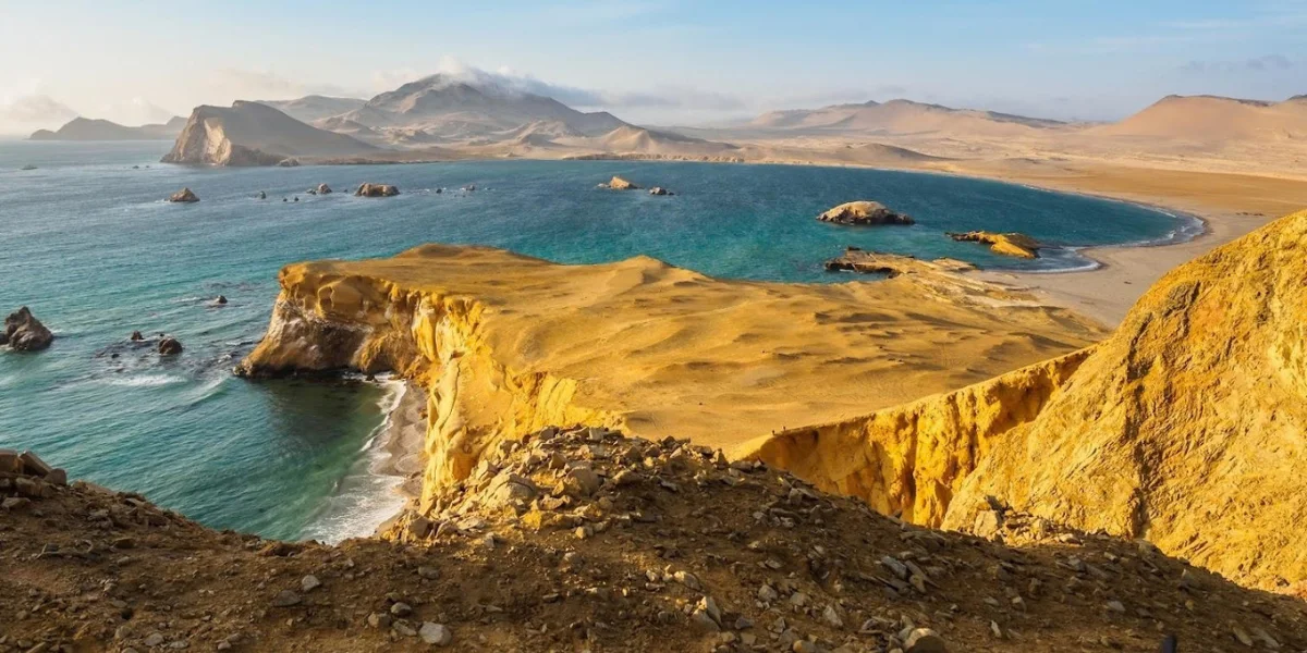 Dramatic desert cliffs and Pacific Ocean in Paracas National Reserve Peru